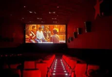 Audience enjoying a movie on a large cinema screen