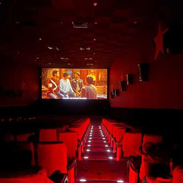 Audience enjoying a movie on a large cinema screen